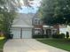 Charming brick home with a two-car garage and well-manicured front lawn at 110 Bristolwood Cir, Morrisville, NC 27560