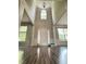 Grand foyer with soaring ceilings, wainscoting, and elegant hardwood floors at 110 Bristolwood Cir, Morrisville, NC 27560
