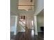 Spacious foyer featuring hardwood floors, soaring ceilings, and an elegant staircase at 110 Bristolwood Cir, Morrisville, NC 27560