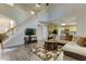 Inviting living room open to the kitchen, showcasing hardwood floors and a cozy atmosphere at 110 Bristolwood Cir, Morrisville, NC 27560