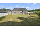 Large backyard featuring a lush lawn, screened-in patio, storage shed, and privacy fencing at 110 Deacon Ridge Ln, Youngsville, NC 27596