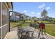 Outdoor patio area with barbecue and wrought iron table and chair set at 110 Deacon Ridge Ln, Youngsville, NC 27596