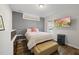 Bedroom features a large window, TV, and a stylish bench at 110 Deacon Ridge Ln, Youngsville, NC 27596