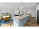 Open-concept kitchen with a large island, seamlessly flowing into the living and dining areas for easy entertaining at 110 Deacon Ridge Ln, Youngsville, NC 27596