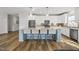 Contemporary kitchen showcasing a spacious island, stainless steel appliances, and sleek backsplash at 110 Deacon Ridge Ln, Youngsville, NC 27596