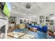 Bright living room with a fireplace, coffered ceiling, and an open layout connecting the kitchen and dining areas at 110 Deacon Ridge Ln, Youngsville, NC 27596