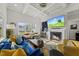 Cozy living room with a fireplace, and coffered ceiling offering a welcoming space for relaxation and entertainment at 110 Deacon Ridge Ln, Youngsville, NC 27596