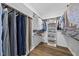 Walk-in closet with custom shelving and hanging racks at 110 Deacon Ridge Ln, Youngsville, NC 27596