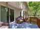 Back deck with wicker furniture and slider, offering a peaceful outdoor space at 110 Ferris Wheel Ct, Cary, NC 27513