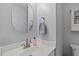 Clean, well-lit bathroom with a modern sink and mirror, offering a fresh and inviting space at 110 Ferris Wheel Ct, Cary, NC 27513