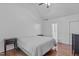 Comfortable bedroom with hardwood floors, neutral bedding, and ample natural light at 110 Ferris Wheel Ct, Cary, NC 27513