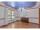 Dining room featuring hardwood floors, elegant chandelier, and a large window with natural light at 110 Ferris Wheel Ct, Cary, NC 27513