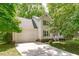 Beautiful home featuring a two-car garage and a well-maintained lawn, surrounded by mature trees at 110 Ferris Wheel Ct, Cary, NC 27513
