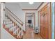 Welcoming foyer with hardwood floors, staircase, and a glimpse into the adjacent living area at 110 Ferris Wheel Ct, Cary, NC 27513