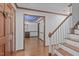Elegant foyer showcasing hardwood floors, detailed trim, and an inviting view of the dining room at 110 Ferris Wheel Ct, Cary, NC 27513