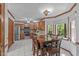 Eat-in kitchen with stainless steel appliances, wooden cabinets, and large windows for natural light at 110 Ferris Wheel Ct, Cary, NC 27513