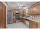 Well-equipped kitchen with stainless steel appliances, tiled backsplash, and ample cabinet space at 110 Ferris Wheel Ct, Cary, NC 27513