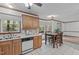 Kitchen with stainless appliances that flows into dining area, great for entertaining Gathering at 110 Ferris Wheel Ct, Cary, NC 27513