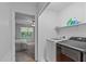 Convenient laundry area with modern washer and dryer, plus bonus shelf storage for supplies at 110 Ferris Wheel Ct, Cary, NC 27513