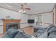 Inviting living room with hardwood floors, a cozy fireplace, and a comfortable sectional couch at 110 Ferris Wheel Ct, Cary, NC 27513