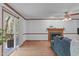 Bright living room featuring a fireplace, wood trim, and access to an outdoor deck at 110 Ferris Wheel Ct, Cary, NC 27513