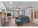 Inviting living room with hardwood floors, fireplace, and a comfortable sectional sofa perfect for relaxation at 110 Ferris Wheel Ct, Cary, NC 27513