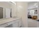 Bathroom vanity with marble countertop and view of adjoining room at 112 Glenspring Way, Morrisville, NC 27560
