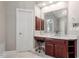 Bathroom vanity with marble countertop and view of adjoining room at 112 Glenspring Way, Morrisville, NC 27560