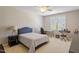 Bedroom with neutral colors, desk and keyboard setup at 112 Glenspring Way, Morrisville, NC 27560