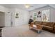 Spacious room features great natural light and room for couches at 112 Glenspring Way, Morrisville, NC 27560