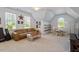 Spacious room features great natural light and room for couches and a dining set at 112 Glenspring Way, Morrisville, NC 27560