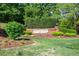 Weston Estates entrance sign featuring manicured landscaping and lush greenery around the brick monument at 112 Glenspring Way, Morrisville, NC 27560
