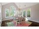 Sunlit dining room with a chandelier, large windows and an airy feel perfect for entertaining guests at 112 Glenspring Way, Morrisville, NC 27560