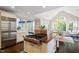 Spacious kitchen featuring a large island with range and stainless steel appliances at 112 Glenspring Way, Morrisville, NC 27560