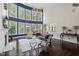 Spacious living room with tall windows, a fireplace, and a cozy seating area at 112 Glenspring Way, Morrisville, NC 27560