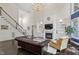 Elegant living room with fireplace and built-in shelving at 112 Glenspring Way, Morrisville, NC 27560
