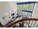 Bright living room with fireplace, built-in shelving, hardwood floors, and large windows at 112 Glenspring Way, Morrisville, NC 27560