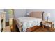 The airy main bedroom features hardwood floors, a vaulted ceiling, and ample natural light at 112 Glenspring Way, Morrisville, NC 27560