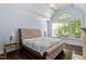 The airy main bedroom features hardwood floors, a vaulted ceiling, and ample natural light at 112 Glenspring Way, Morrisville, NC 27560