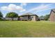 Expansive backyard view highlighting the home's large lawn and peaceful neighborhood setting at 116 Colonade Ct, Benson, NC 27504