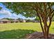 Scenic backyard featuring mature trees and a community of well-spaced homes at 116 Colonade Ct, Benson, NC 27504