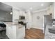 Bright kitchen featuring white cabinets, granite countertops, and stainless steel appliances at 116 Colonade Ct, Benson, NC 27504