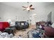 Spacious living room with a piano, ceiling fan, and comfortable furniture, ready for entertaining at 116 Colonade Ct, Benson, NC 27504