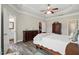 Comfortable main bedroom with wood floors and en-suite bathroom and closet at 116 Colonade Ct, Benson, NC 27504