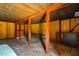 Unfinished basement featuring wood paneling, sturdy support beams, and a versatile space ready for customization at 117 Castlerock Dr, Durham, NC 27713