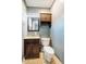 Small bathroom with neutral decor, including an espresso vanity and a toilet at 117 Castlerock Dr, Durham, NC 27713