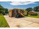 Backyard featuring a screened deck, ample parking, and well-kept yard at 117 Castlerock Dr, Durham, NC 27713
