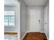 Entryway features hardwood floors, neutral paint, and a view into the living room at 117 Castlerock Dr, Durham, NC 27713