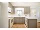 Updated kitchen with gray cabinets, white countertops, subway tile backsplash, and stainless appliances at 117 Castlerock Dr, Durham, NC 27713