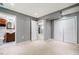 Inviting living room showcasing neutral walls, tiled floors, and a bathroom entrance at 117 Castlerock Dr, Durham, NC 27713